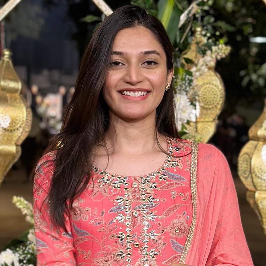 Creative writing objects on a table; pens, pencils, a sketch book, and a cup of coffee.