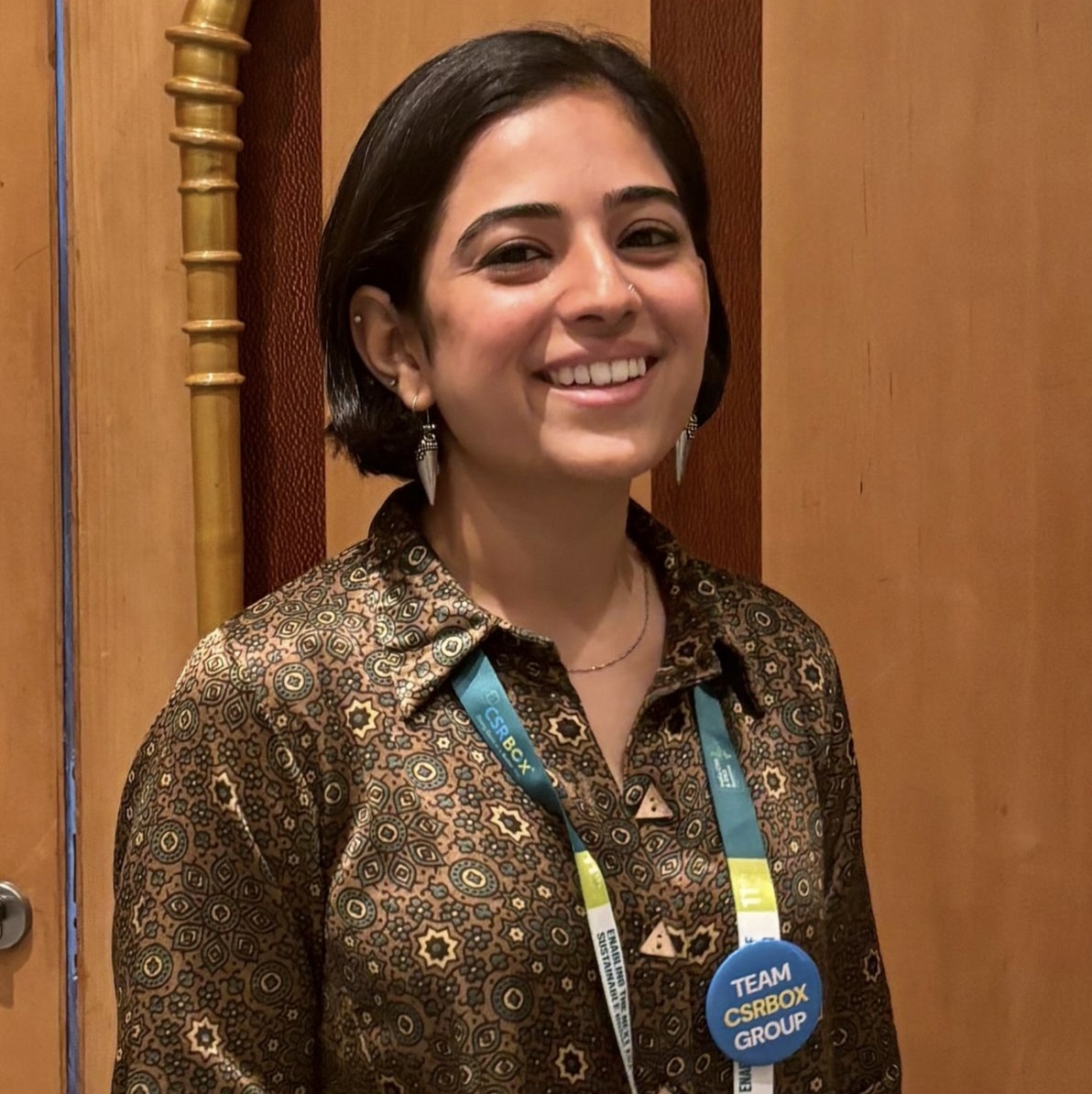 Creative writing objects on a table; pens, pencils, a sketch book, and a cup of coffee.