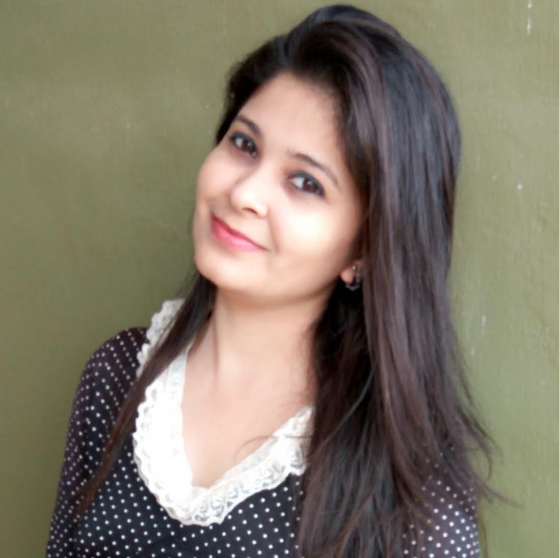 Creative writing objects on a table; pens, pencils, a sketch book, and a cup of coffee.