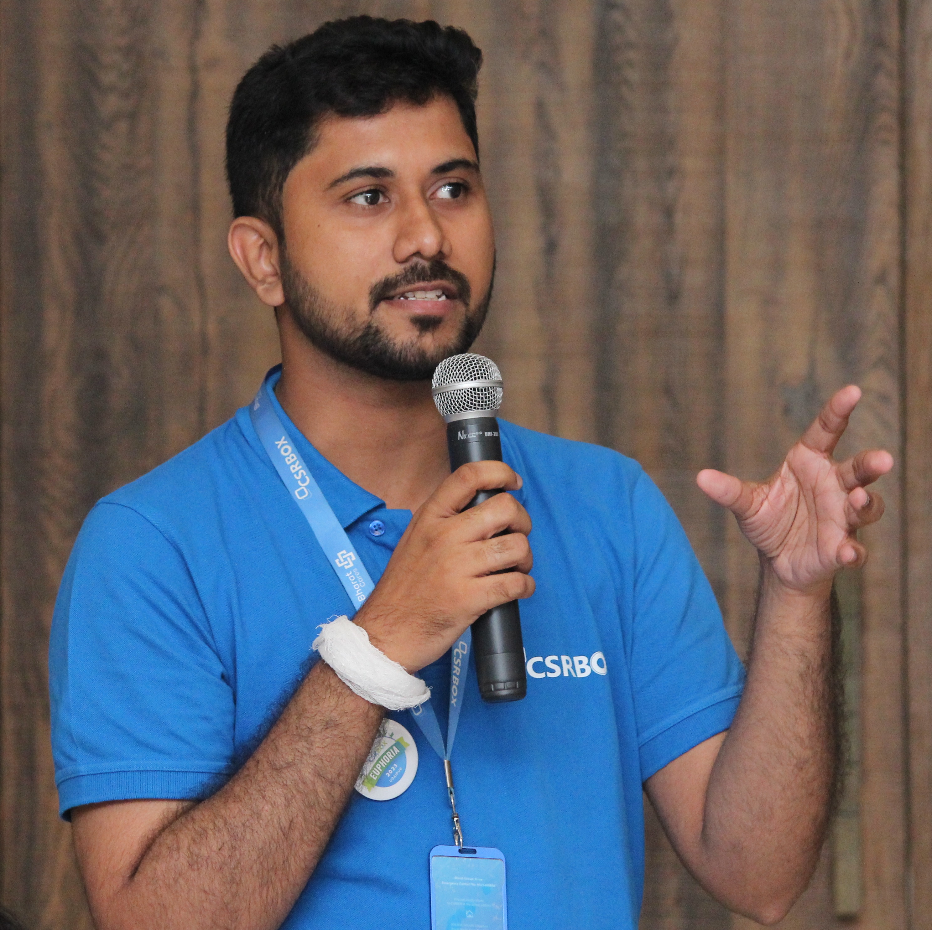 Creative writing objects on a table; pens, pencils, a sketch book, and a cup of coffee.